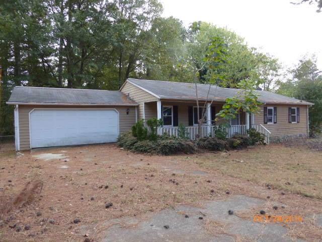 1118 Blazing Ridge Lawrenceville, GA 30046 - Photo 1 of 1 a front view of a house with a yard