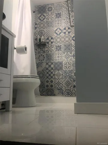 a bathroom with a toilet and a sink