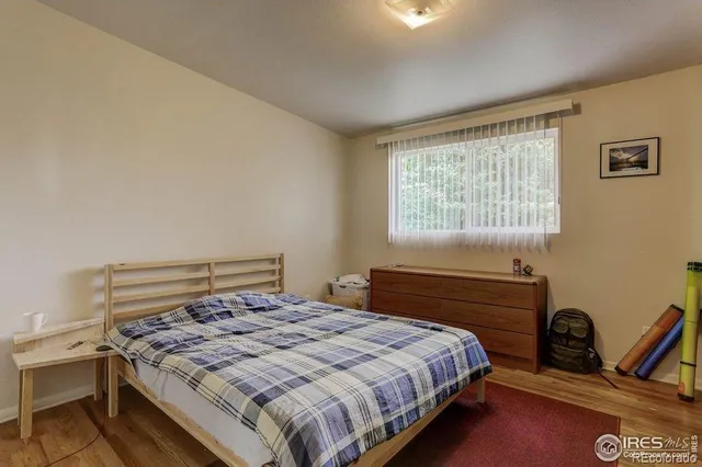 a view of workspace with wooden floor windows