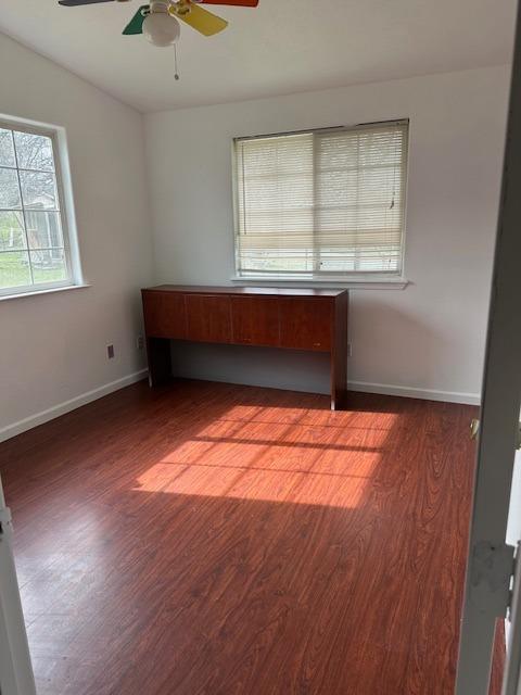16164 Nugget Road Corning, CA 96021 - Photo 30 of 53 an empty room with wooden floor and windows