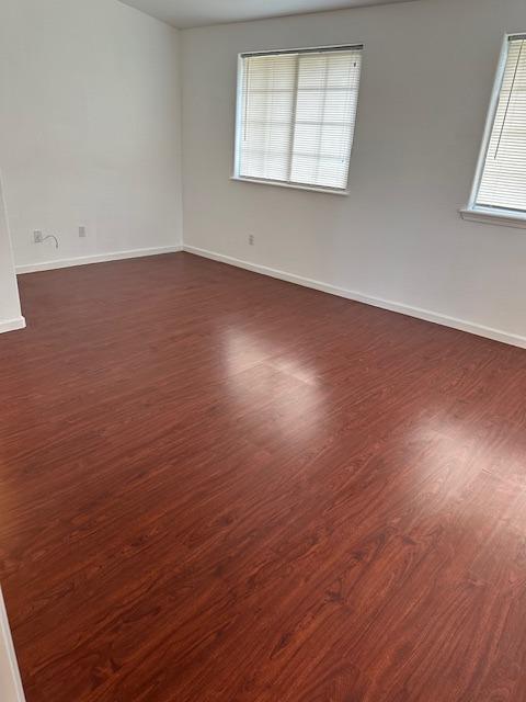 16164 Nugget Road Corning, CA 96021 - Photo 31 of 53 an empty room with wooden floor and windows