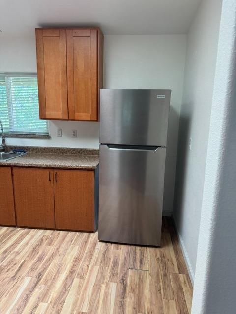 16164 Nugget Road Corning, CA 96021 - Photo 39 of 53 a kitchen with a refrigerator and cabinets