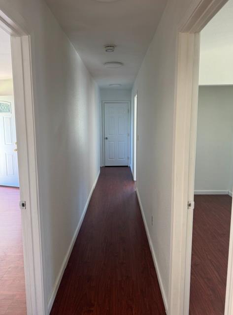 16164 Nugget Road Corning, CA 96021 - Photo 46 of 53 a view of a hallway with wooden floor