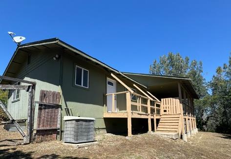16164 Nugget Road Corning, CA 96021 - Photo 8 of 53 a front view of a house with a garage
