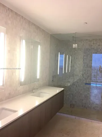 a bathroom with a bathtub and a sink