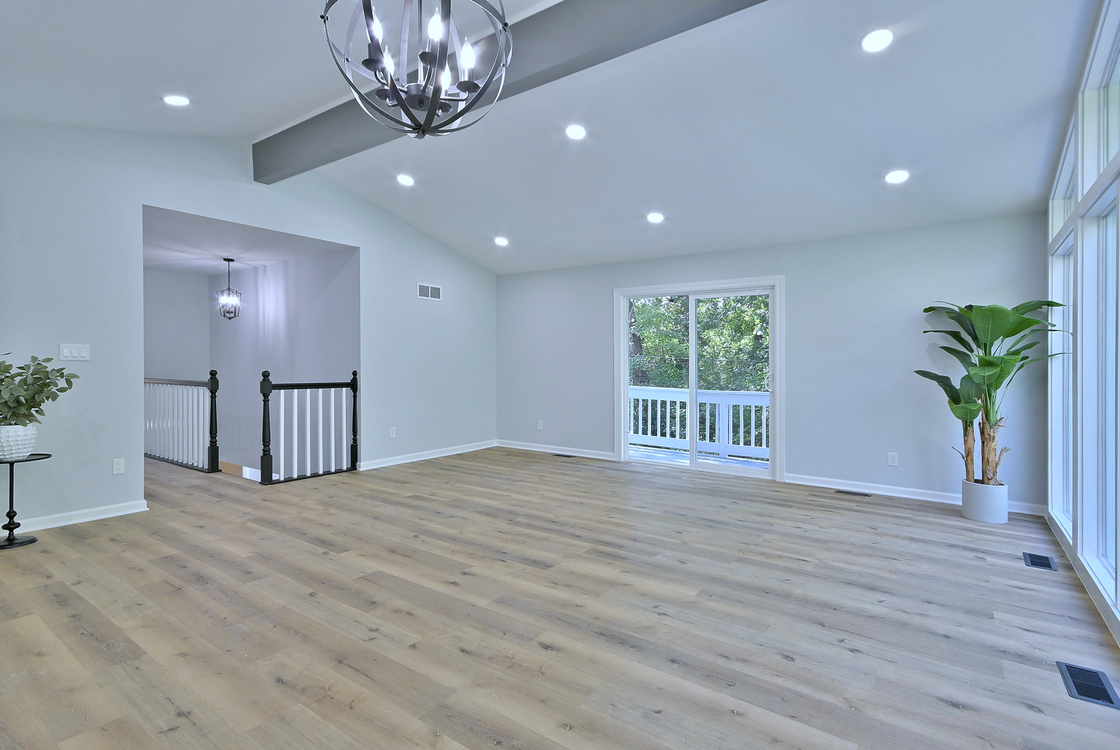 1605 Middletree Road Joliet, IL 60433 - Photo 8 of 44 a view of an empty room with a window and wooden floor