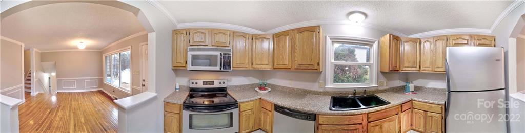 408 Ashbrook Road Salisbury, NC 28147 - Photo 46 of 48 a kitchen with stainless steel appliances kitchen island granite countertop a sink and cabinets