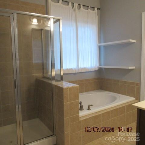 8520 Dargan Lane Waxhaw, NC 28173 - Photo 13 of 19 a bathroom with a tub and shower