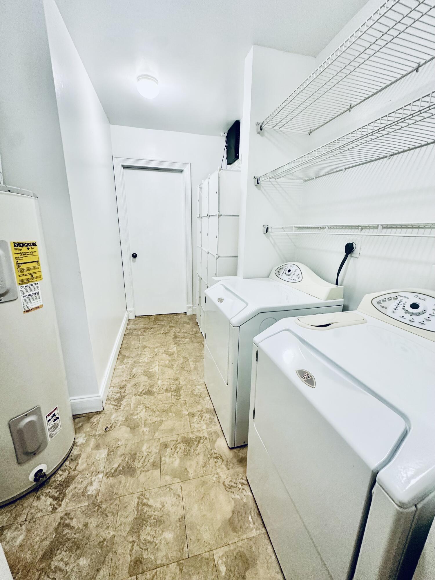 17768 Maplewood Drive Boca Raton, FL 33487 - Photo 16 of 50 a utility room with dryer and washer