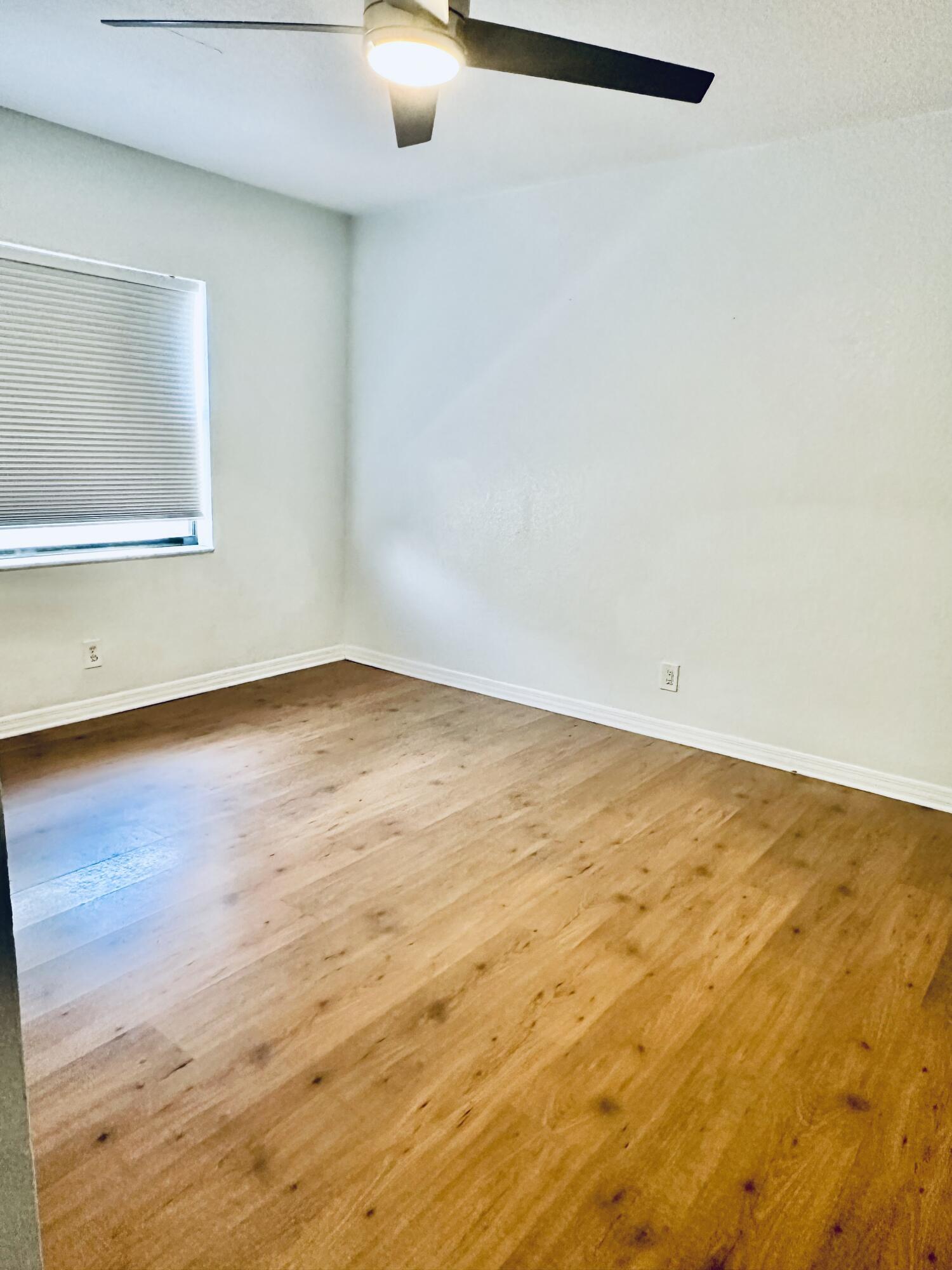 17768 Maplewood Drive Boca Raton, FL 33487 - Photo 18 of 50 a view of empty room with wooden floor