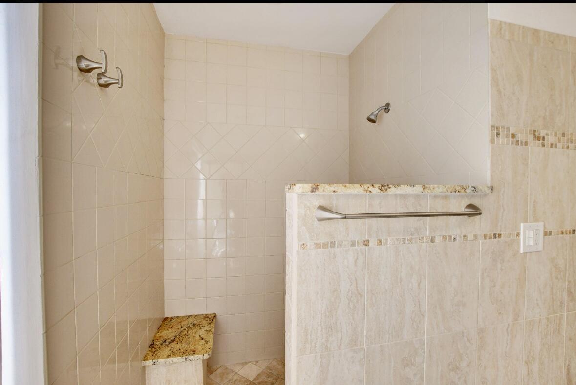 17768 Maplewood Drive Boca Raton, FL 33487 - Photo 30 of 50 a bathroom with a bathtub