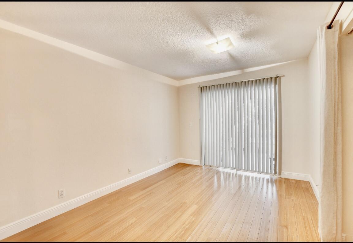 17768 Maplewood Drive Boca Raton, FL 33487 - Photo 34 of 50 a view of a room with wooden floor
