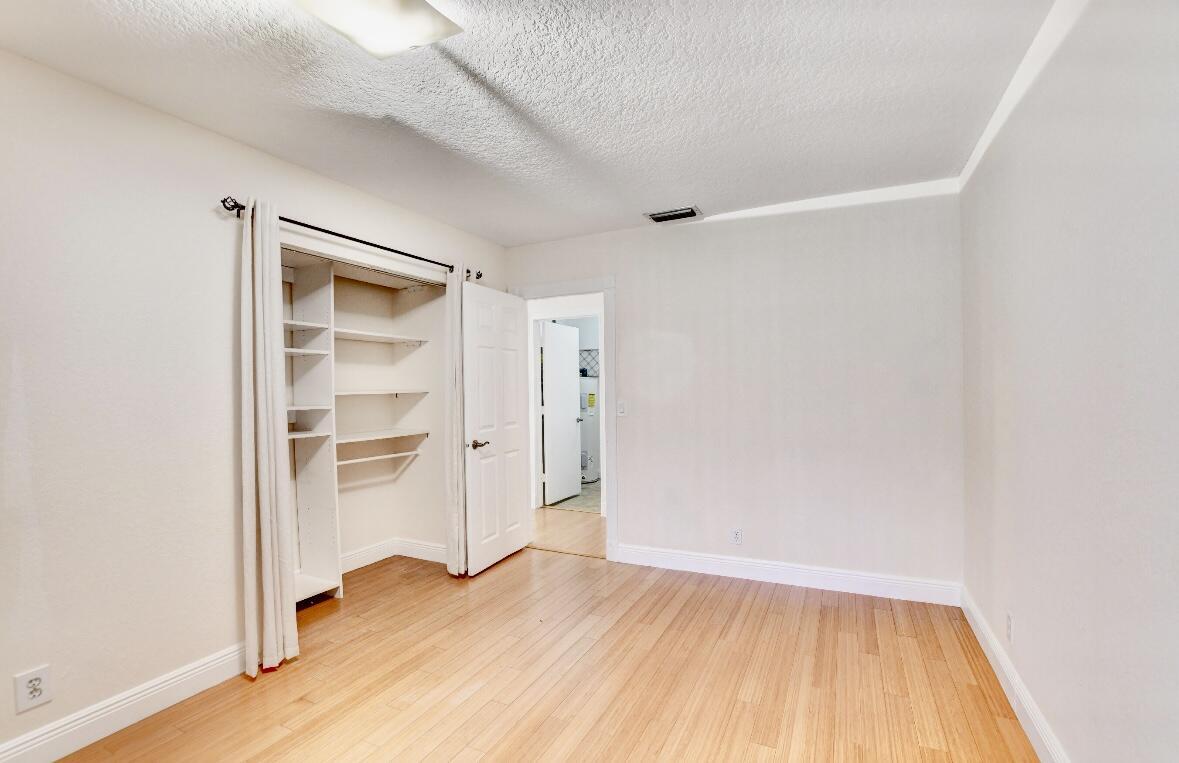 17768 Maplewood Drive Boca Raton, FL 33487 - Photo 35 of 50 a view of empty room with wooden floor