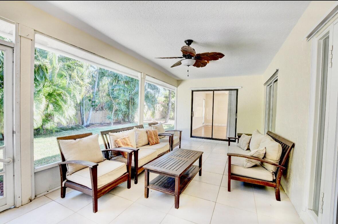17768 Maplewood Drive Boca Raton, FL 33487 - Photo 36 of 50 a living room with furniture and a large window