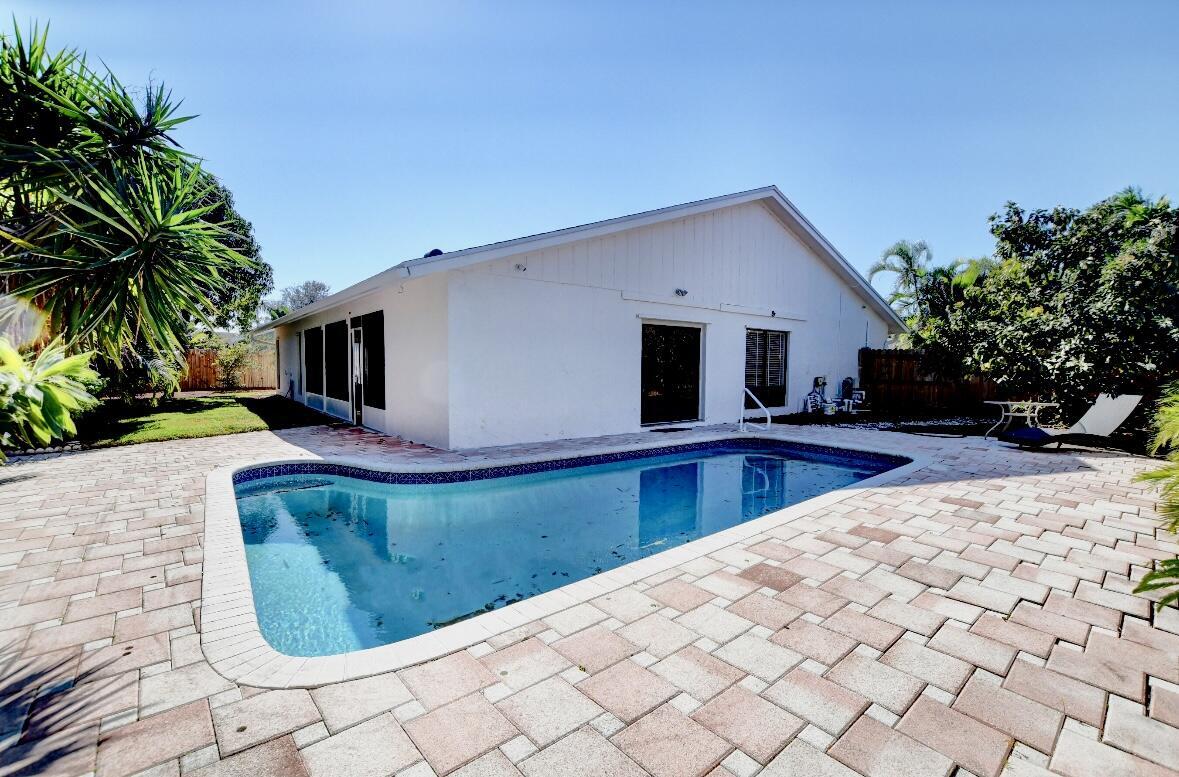 17768 Maplewood Drive Boca Raton, FL 33487 - Photo 41 of 50 a view of swimming pool with a backyard