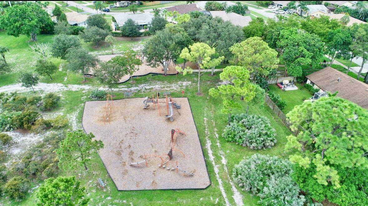 17768 Maplewood Drive Boca Raton, FL 33487 - Photo 46 of 50 an aerial view of a house with a yard and trees all around