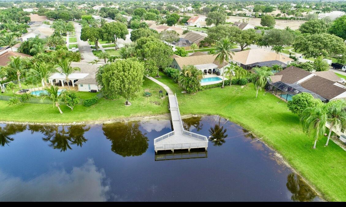 17768 Maplewood Drive Boca Raton, FL 33487 - Photo 49 of 50 a view of a lake with a yard