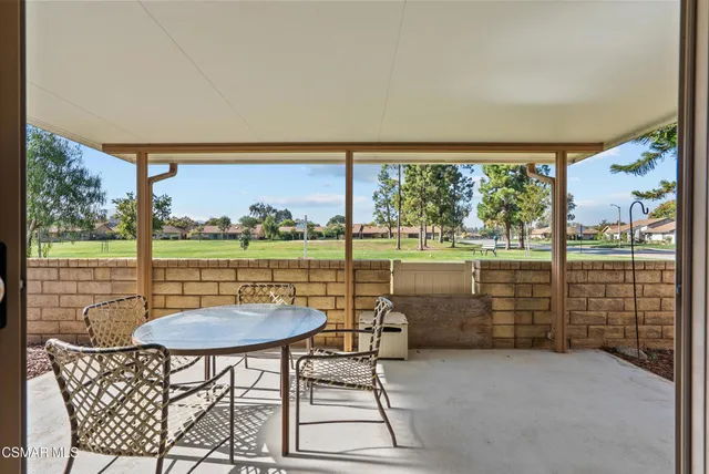 an aerial view of a house with a garden and trees