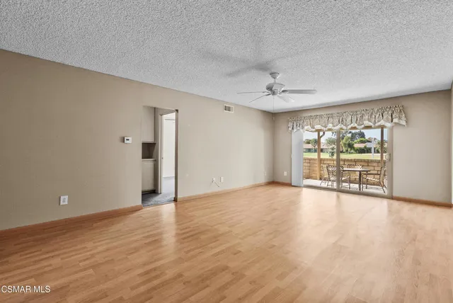 a view of an empty room with a window