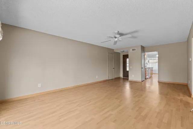 a kitchen that has a sink and a stove