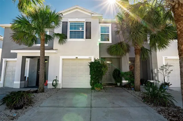 a front view of house with small garden