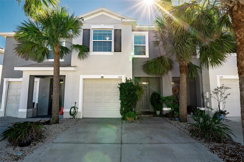 a front view of house with small garden