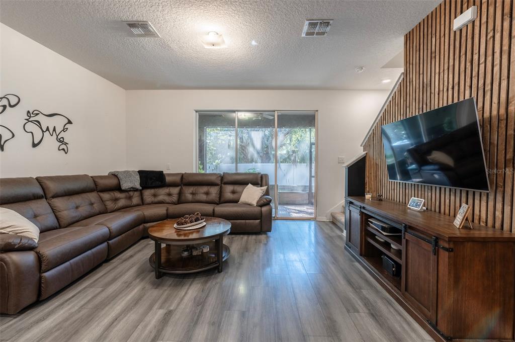 3327 Pleasant Willow Court Brandon, FL 33511 - Photo 14 of 28 a living room with furniture and a flat screen tv