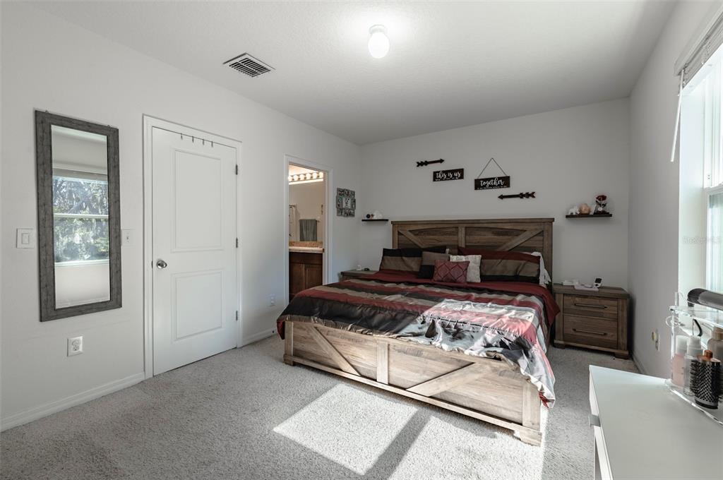 3327 Pleasant Willow Court Brandon, FL 33511 - Photo 16 of 28 a bedroom with a bed and window