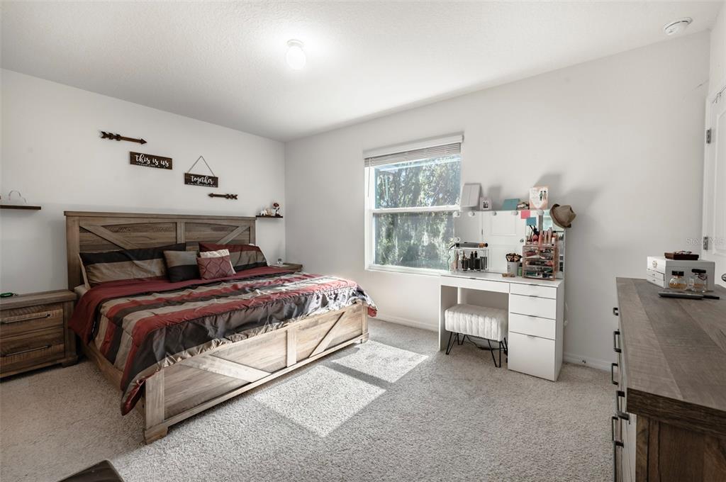 3327 Pleasant Willow Court Brandon, FL 33511 - Photo 17 of 28 a bedroom with a bed and a window