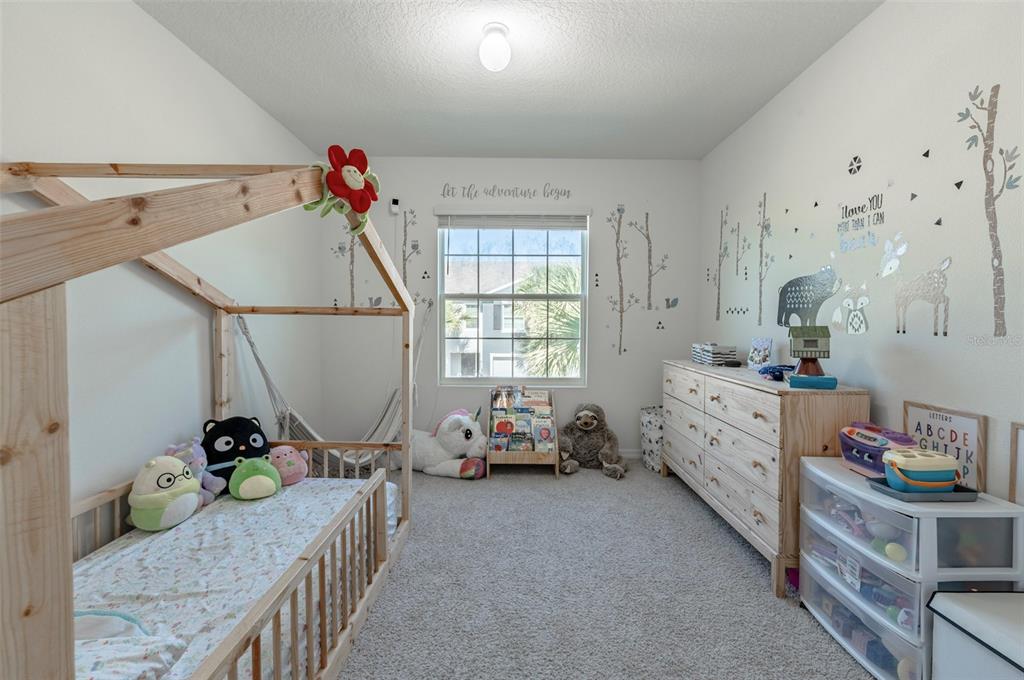 3327 Pleasant Willow Court Brandon, FL 33511 - Photo 21 of 28 a bedroom with furniture and a bed