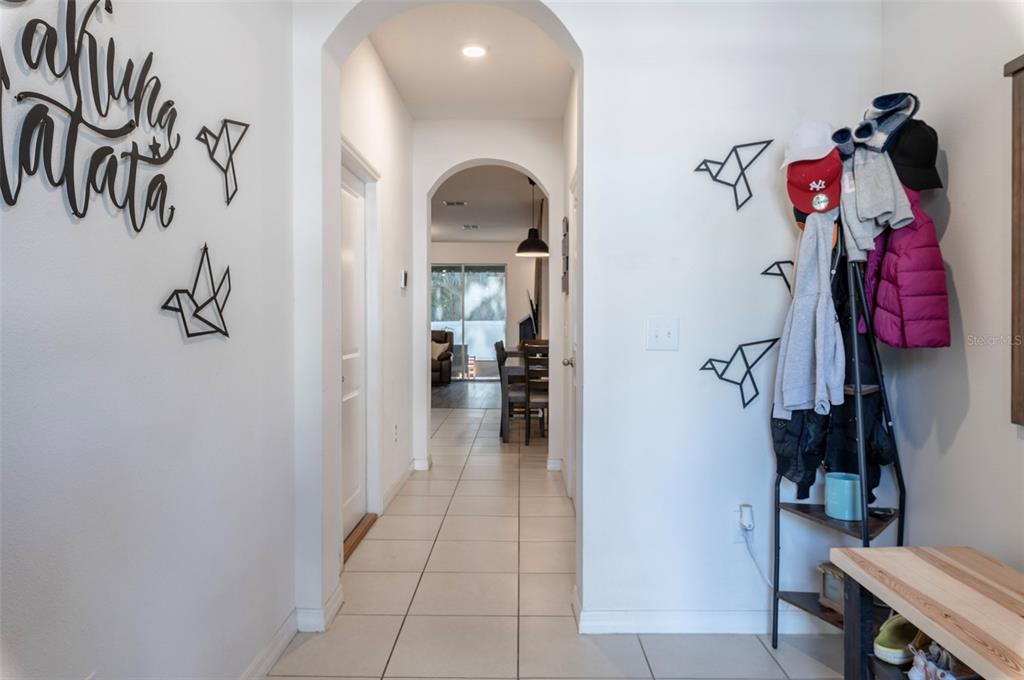 3327 Pleasant Willow Court Brandon, FL 33511 - Photo 3 of 28 a view of a hallway with closet and a rug