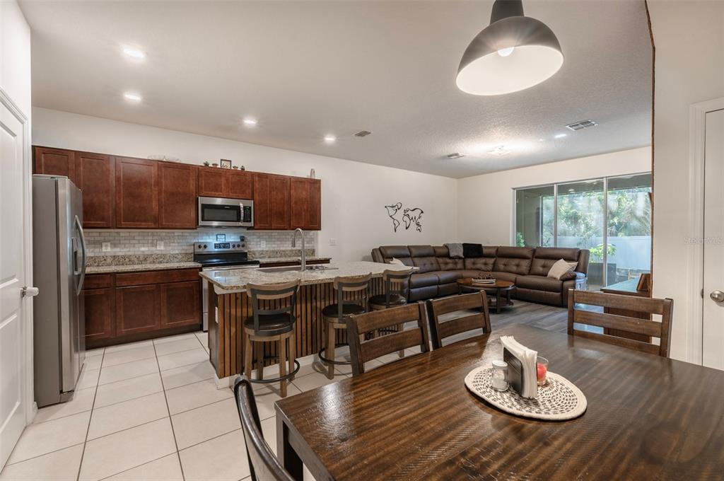 3327 Pleasant Willow Court Brandon, FL 33511 - Photo 7 of 28 a kitchen with a table and chairs in it