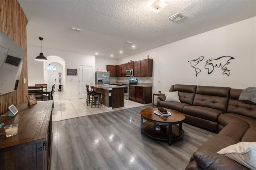 3327 Pleasant Willow Court Brandon, FL 33511 - Photo 10 of 28 a living room with furniture and a wooden floor