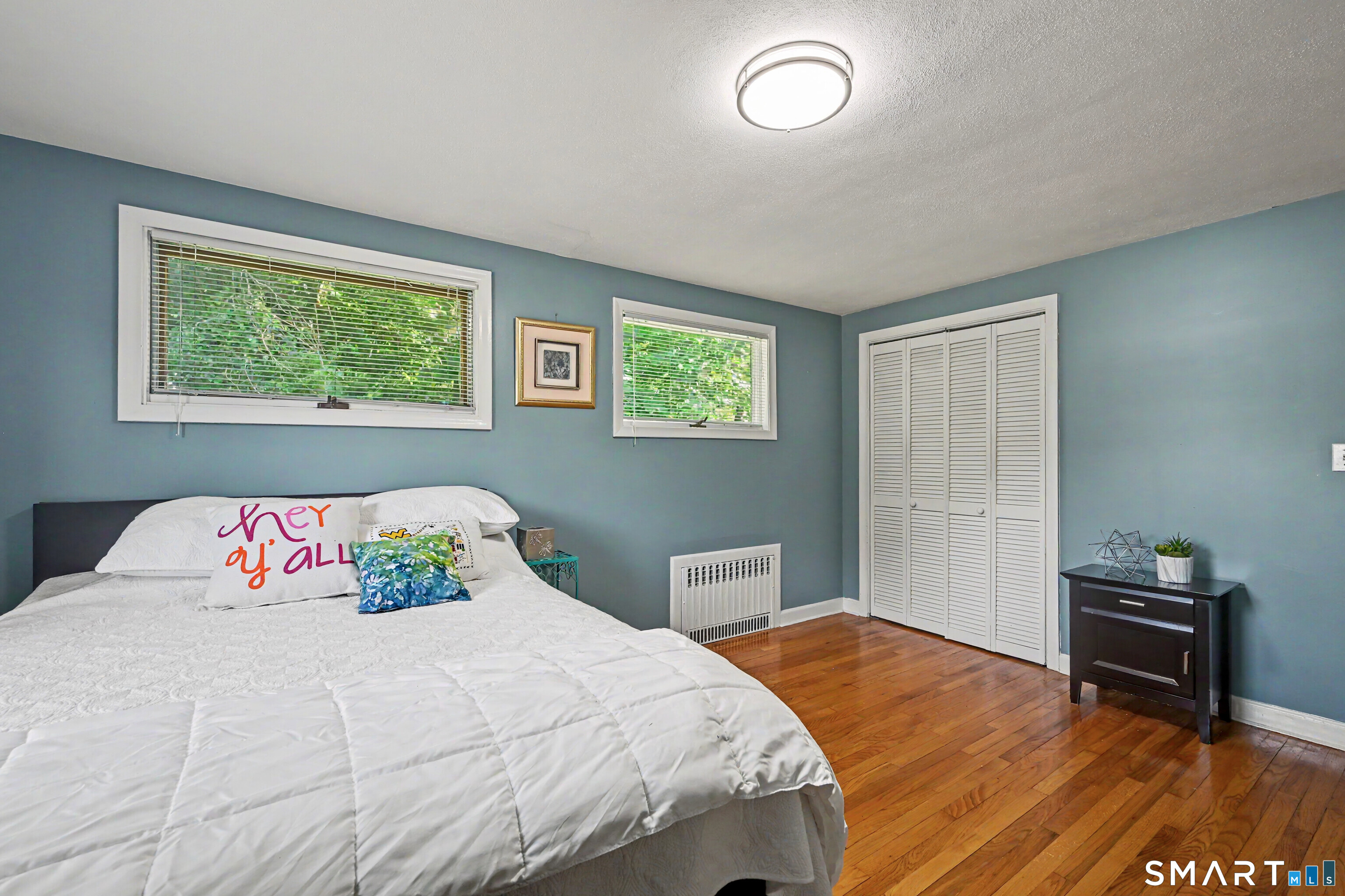 524 Ferry Road Orange, CT 06477 - Photo 29 of 40 a bedroom with a bed and a window