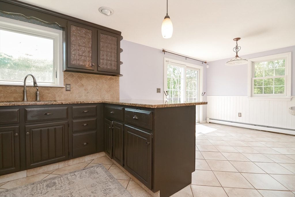 633 Williams Street Dighton, MA 02764 - Photo 15 of 41 a kitchen with a sink a window and cabinets
