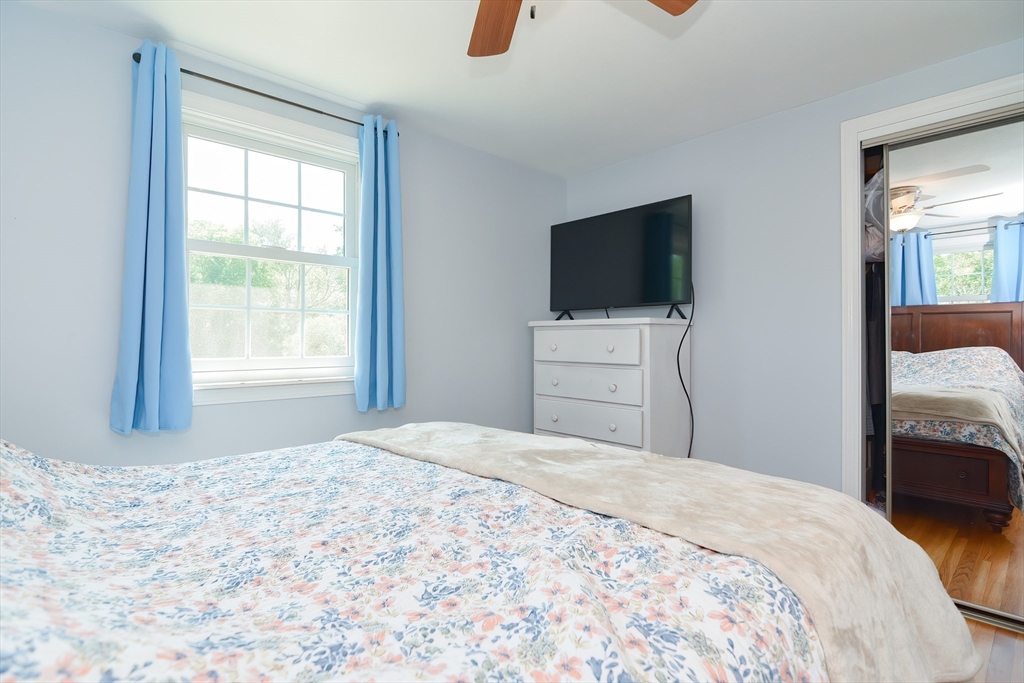 633 Williams Street Dighton, MA 02764 - Photo 20 of 41 a bedroom with a bed and a flat screen tv