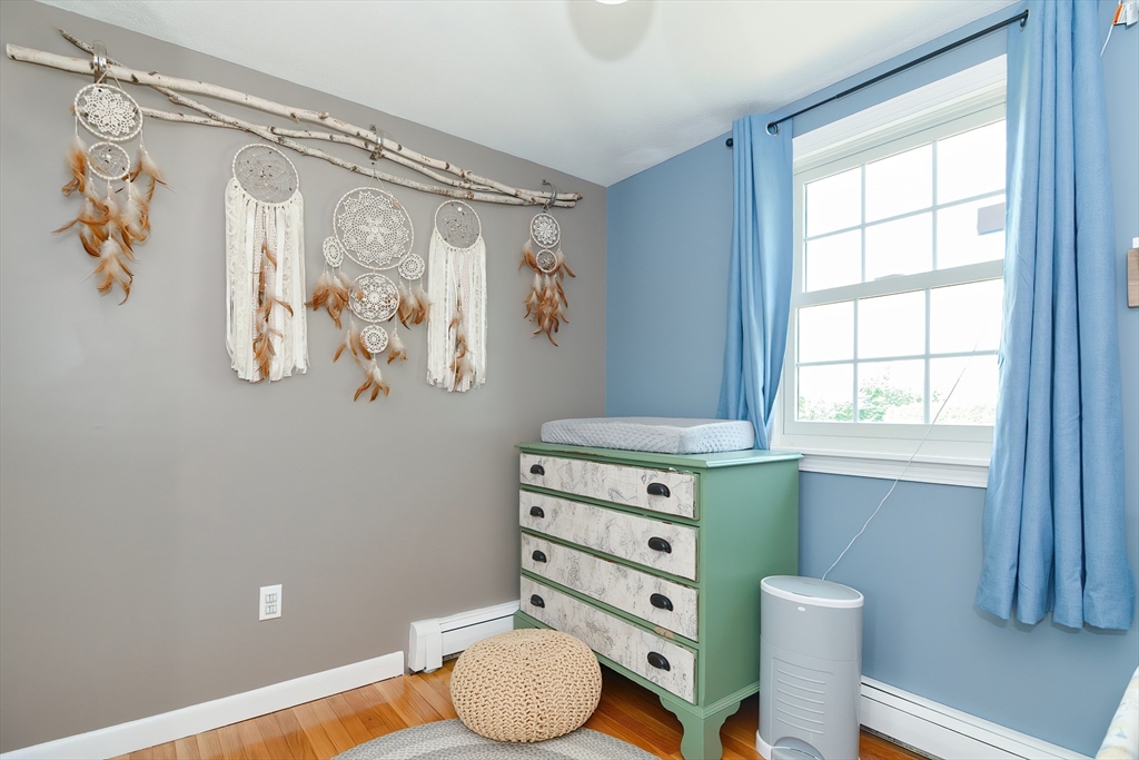 633 Williams Street Dighton, MA 02764 - Photo 23 of 41 a bathroom with a granite countertop sink a toilet and a window