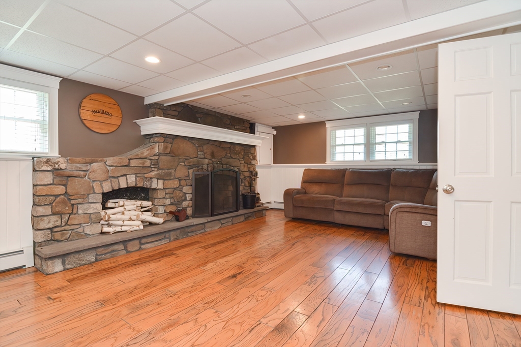 633 Williams Street Dighton, MA 02764 - Photo 29 of 41 a living room with furniture and a fireplace