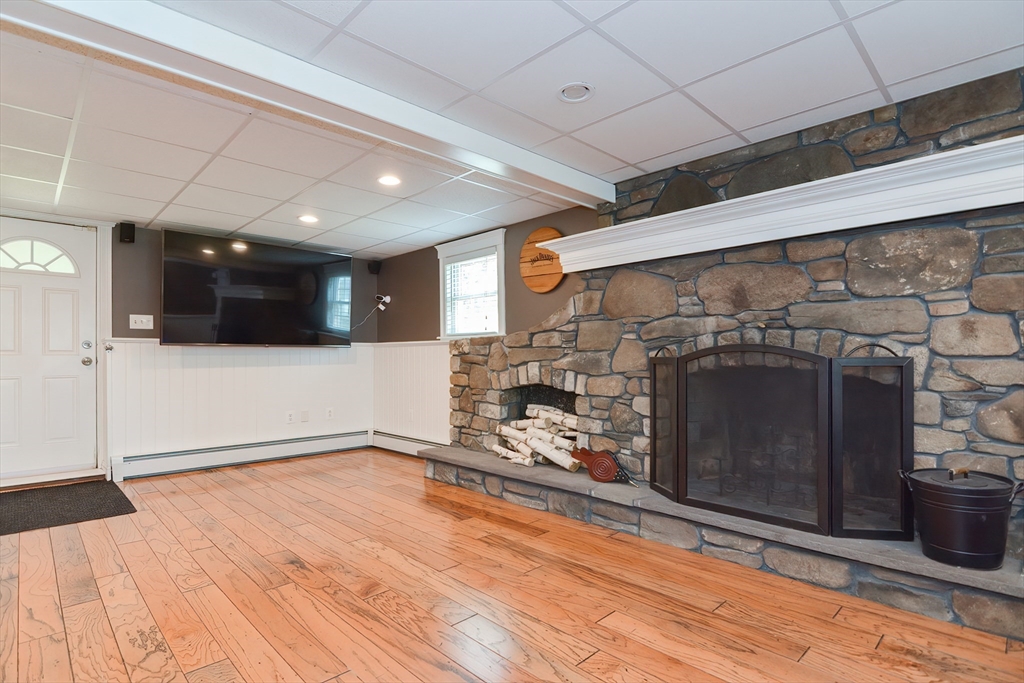 633 Williams Street Dighton, MA 02764 - Photo 32 of 41 a view of a livingroom with an empty space and a fireplace