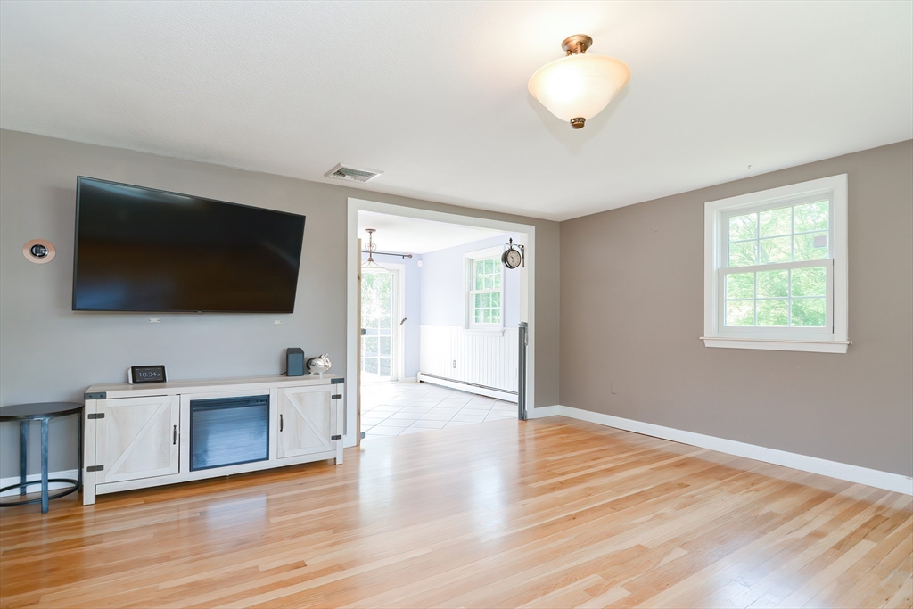 633 Williams Street Dighton, MA 02764 - Photo 9 of 41 a view of a livingroom with an empty space and a window