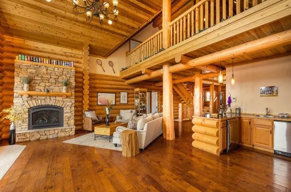 a bedroom with furniture and wooden floor