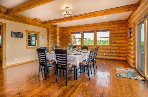 a bathroom with a granite countertop sink a mirror and a shower