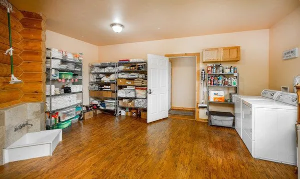 a kitchen with stainless steel appliances granite countertop a refrigerator a stove top oven a sink and dishwasher