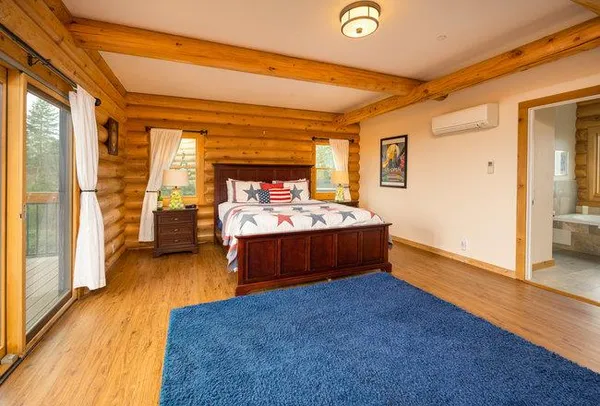 a living room with furniture and a rug