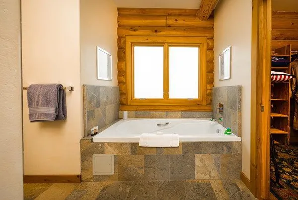 a bathroom with a granite countertop sink a mirror and a