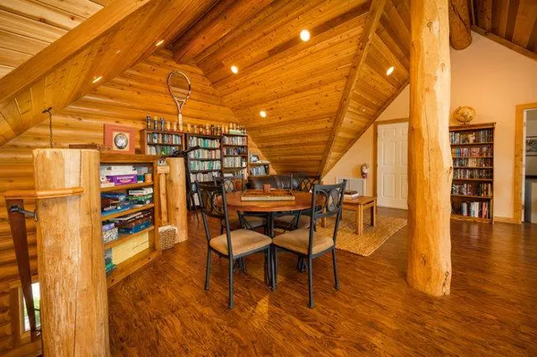 a view of a livingroom with furniture wooden floor and a rug