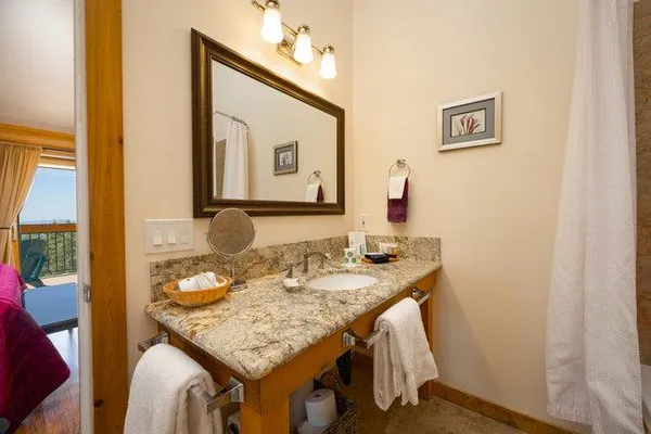 an aerial view of a house with a big yard