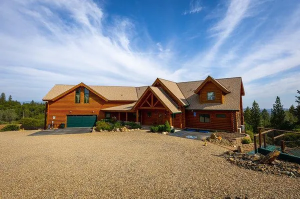 a bed room with a bed and a large window