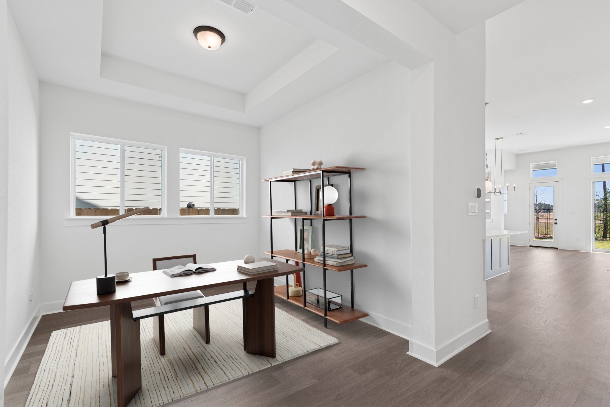 16138 Rita Road Conroe, TX 77302 - Photo 4 of 50 a workspace with furniture window and wooden floor