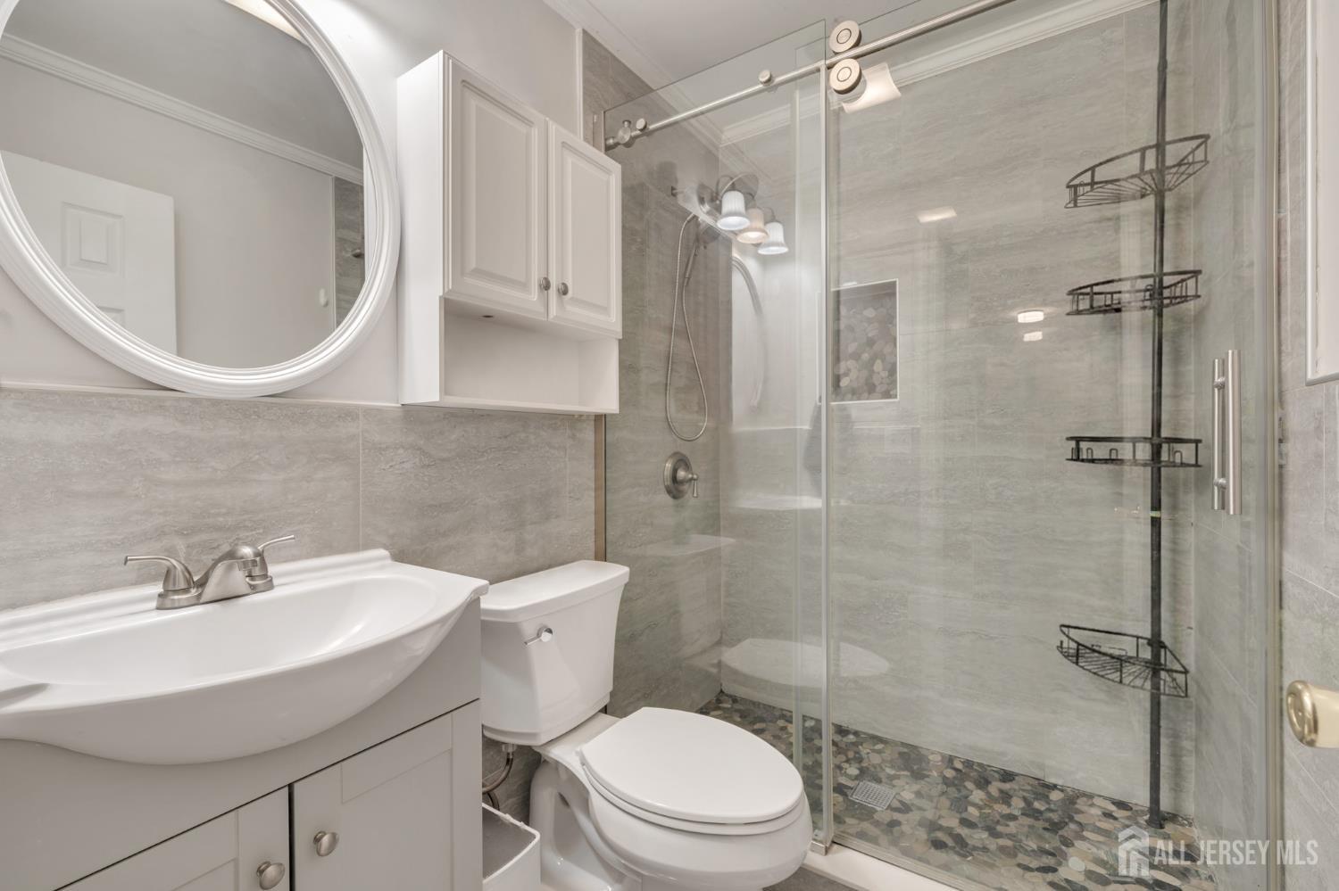 12 Pierrepont Avenue Middlesex, NJ 08846 - Photo 19 of 30 a bathroom with a sink a toilet and shower